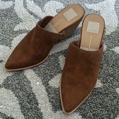 Brand New Brown Closed Toe Mules With Sculpted Heel, Brown Pointed Toe Heels For Spring, Brown Suede Mules For Fall, Brown Pointed Toe Sandals For Fall, Brown Slip-on Sandals With Sculpted Heel, Brown Almond Toe Mules With Sculpted Heel, Brown Suede Heels With Stacked Heel, Chic Brown Slip-on Mules, Brown Block Heel Mules With Branded Heel Counter