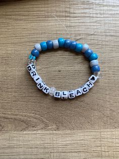 Hand made beaded Bracelet! One size fits all (let me know in the personalization tab if you would like it to be on the bigger or smaller side). I use a clear elastic band that can stretch. Nail polish is used to seal the string together. Let me know if you would like a color other than blue :) Funny Clay Bead Bracelet, Funny Best Friend Bracelets, Best Friend Kandi Bracelets, Word To Put On Bracelet, Random Bracelet Ideas, Funny Pony Bead Bracelets, Sister Bracelet Ideas, Clay Bead Bracelet Ideas Grunge, Bracelet Word Ideas Funny