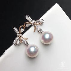 This is a unique earring. All Akoya pearls are imported directly from the pearl farms of Japan. The earring is comprised of the finest quality 18k gold. Please contact us if you have any questions. Remember to mention the product name in your email. Product Information Origin Japan Material Akoya Pearl, 18k White Gold, and Natural Diamond Dimensions Earring Lenght Approx. 2.2cm Pearl Shaped: Round Size: 8-8.5mm Quality: AAA Nacre: Very Thick Color: White Luster: Very High Accessories Metal: 1.86 Luxury Pearl Pendant Earrings As Gift, White Gold Pearl Pendant Earrings Gift, Luxury Pearl Charm Earrings As Gift, Luxury Pearl Pendant Round Earrings, Luxury Round Pearl Pendant Earrings, Luxury Pearl Pendant Earrings, Elegant Akoya Pearl Earrings For Gift, White Akoya Pearl Drop Earrings, Formal White Akoya Pearl Earrings