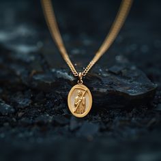 Experience the divine protection and guidance with our solid gold Santa muerte pendant. Expertly crafted in the USA, this exquisite piece honors the revered figure of Santa Muerte, celebrated for bestowing blessings and safekeeping. Made from premium solid gold, it showcases intricate detailing that brings the iconic imagery to life, making it a powerful symbol of faith and devotion. PENDANT INFORMATIONThis pendant is made of real, solid gold.• Made in USA• Material: 14k or 18k solid gold• Finish: polished• Height: 1.25" (31,5 mm) | *includes the small circle, bail dimensions not included• Width: 0.84" (21 mm)• Pendant weight: approx. 8 grams (14k)• Bail: fits up to 4 mm chains• Solid back, not hollow• A certificate of authenticity is included• Delivered in our elegant jewelry box, making April Crafts, Divine Protection, Solid Gold Chains, Small Circle, Box Making, Yellow Gold Pendants, Elegant Jewelry, The Divine, Certificate Of Authenticity