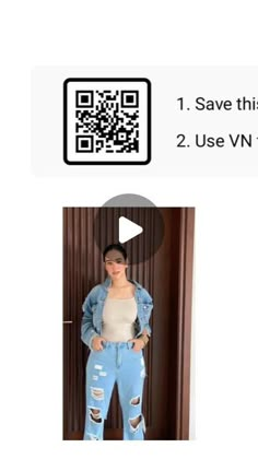 a woman standing next to a wooden door with qr code on her shirt and jeans