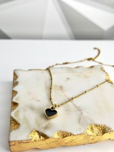 Our Double-sided Heart Necklace, made from 18k gold-plated stainless steel, is sure to make a bold and stylish statement. The timeless color combination of white and black is perfect for any occasion, whether you’re dressing up or down. Wear it with your favorite outfit and let your heart shine! 💖 Features: 18k Gold Plated High-Quality Stainless Steel Tarnish Free NK-001 Black Metal Heart Necklace With Adjustable Chain, Trendy Black Metal Heart Necklace, Trendy Black Heart Necklace With Clavicle Chain, Trendy Black Double Heart Jewelry, Chic Black Heart-shaped Jewelry, Black Metal Necklace With Heart Charm, Trendy Black Heart-shaped Necklace, Elegant Black Heart Necklace With Adjustable Chain, Black Metal Heart Necklace With Heart Charm