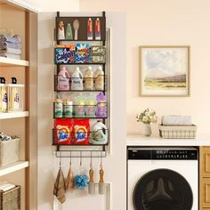 a laundry room with a washer and dryer on the wall next to it