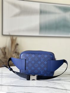 Blue Limited Edition Outdoor Waist Bag combines Monogram canvas and soft Taïga leather, using harmonious tones to outline modern lines. The internal structure is well-organized, and you can safely store your belongings while freeing your hands. Dimensions: 21.0 x 17.0 x 5.0 cm Modern Saffiano Leather Bag With Leather Trim, Designer Travel Bag In Saffiano Leather, Designer Saffiano Leather Travel Bag, Modern Blue Belt Bag For Travel, Modern Blue Belt Bag For Everyday Use, Functional Blue Bags With Detachable Strap, Modern Pouch Bag With Leather Trim, Blue Rectangular Belt Bag For Travel, Modern Pouch Bags With Leather Trim