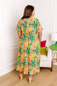 - Head to happy hour by the beach with this vibrant dress! - Lightweight material with a colorful abstract botanical print - A built-in partial lining ending - A v-cut neckline that goes down into a drawstring ruched bodice with a tie detail - Short puff sleeves with elastic cuffs - A waistline with an elastic back - Functional side pockets - A relaxed silhouette that ends in a straight hemline Vibrant Dress, Abstract Botanical, The Maldives, Ruched Bodice, By The Beach, Botanical Print, V Cuts, Colorful Abstract, Botanical Prints