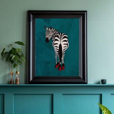 a painting of a zebra is hanging on the wall above a blue shelf with a potted plant