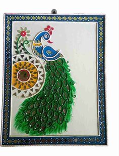 an artistically designed tile with a peacock on it's back and green feathers