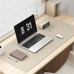 an open laptop computer sitting on top of a desk next to a mouse and keyboard