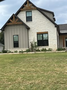 a dog is standing in front of a house