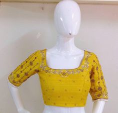 Pure raw silk blouse with maggam work on neck sleeves and back neck. Custom fitted. -Measurements sheet will be sent to you once you order( Standard sizing also available) -Custom colors available -Work on front back and sleeves. Fitted Dola Silk Top With Handwork, Fitted Silk Top With Handwork, Yellow Unstitched Art Silk Blouse, Yellow Silk Blouse With Resham Embroidery, Yellow Silk Blouse With Dori Work, Yellow Silk Blouse Piece With Dori Work, Yellow Chanderi Blouse With Pallu, Chanderi Yellow Blouse With Pallu, Yellow Art Silk Blouse