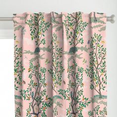 a pink curtain with birds and trees on it