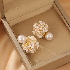 ✦ Indulge in the romance of our elegant stud earrings adorned with a delicate flower pearl design, perfect for adding a touch of grace to your wedding ensemble or elevating your bridesmaid look. Crafted with meticulous detail, these earrings encapsulate the essence of romance, making them an ideal choice for those special occasions. The timeless appeal of the flower pearl design adds a subtle and sophisticated charm, making these earrings a versatile accessory for various elegant events. Whether Feminine White Pearl Earrings For Evening, Chic Pearl Embellished Earrings For Wedding, Chic Pearl White Pearl Earrings For Wedding, Chic Pearl White Earrings For Wedding, Feminine Pearl Drop Flower Earrings, Feminine Pearl White Drop Bridal Earrings, Elegant Pearl White Jewelry With 3d Flowers, Pearl White Flower Drop Earrings, Feminine Pearl White Bridal Earrings