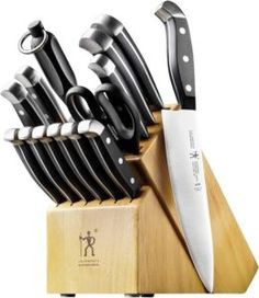 an assortment of knives in a wooden block