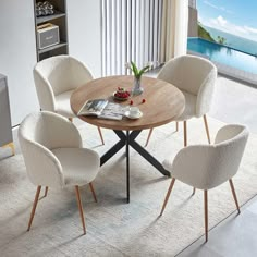 a round table with four chairs around it