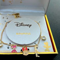 Disney Minnie Mouse Charm Bracelet , Iconic Face, The Word Beautiful, 2 Heart Shaped Crystal And A Pink Bow Makes Up The Dangling Charms. Pull Chains Adjust To A Comfortable Fit. Fine Silver Plated , Gold Tone Color. Themed Jewelry For Disney Fan Events, Disney Jewelry For Valentine's Day Gift, Disney Style Jewelry For Valentine's Day Gift, Silver Disney Charm Bracelet Gift, Silver Disney Charm Bracelet As A Gift, Adjustable Disney Style Bracelets, Disney Style Pink Jewelry Gift, Disney Heart Shaped Jewelry Gift, Pink Disney Jewelry For Gifts