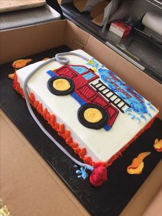 a birthday cake in the shape of a tractor