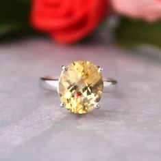 Presenting you a beautiful Adjustable Ring with Yellow/Light Golden Topaz in oval checker cut Shape to sparkle and reflect the light more on facets when you wear and move your finger.  Easy and adjustable Ring so you can wear it daily. The Color Of Topaz Is Pastel Yellow /Light Golden gives you Fresh Vibes every time you wear it. An Adorable Gift for your Loved one as a proposal or anniversary , Birthday Gift Item No: skj. 14.482 Item:Natural Yellow Topaz Cluster Ring In 925 Sterling Silver Primary stone: Yellow Topaz Secondary Stone:--- Article Weight:3.4  gms primary stone Size : 12x10 mm Ring Length:2 cm Ring Width:1.1 cm Maintenance Tips 1.Keep the jewelry away from direct heat, water, perfumes, deodorants, and other strong chemicals.  2.Wipe the Jewellery gently with a chamois cloth o Yellow Oval Birthstone Promise Ring, Oval Yellow Topaz Promise Ring, Yellow Oval Topaz Promise Ring, Oval Yellow Citrine Birthstone Ring, Oval Citrine Birthstone Ring, Oval Yellow Gold Birthstone Anniversary Ring, Oval Yellow Birthstone Anniversary Ring, Yellow Oval Birthstone Anniversary Ring, Yellow Topaz Ring With Center Stone In Sterling Silver