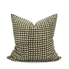 a black and white pillow with a checkered pattern on the front, sitting on a white background