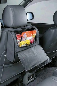 the back seat is filled with snacks and other things to put in it's pocket