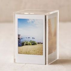 an open photo album sitting on top of a table