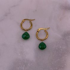 Materials: Stainless steel gold-plated hoop earrings, green onyx.  Sizing + Fit: 15mm hoops. Gold Jade Hoop Jewelry, Green May Birthstone Hoop Earrings, Green Dangle Hoop Earrings, Green Pierced Hoop Earrings, Green Tarnish-resistant Huggie Jewelry, Green Tarnish-resistant Hoop Jewelry, Everyday Green Huggie Earrings, Minimalist Green Gold-plated Earrings, Hypoallergenic Gold Plated Green Jewelry