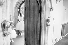 the bride and her flower girl are getting ready to walk down the aisle