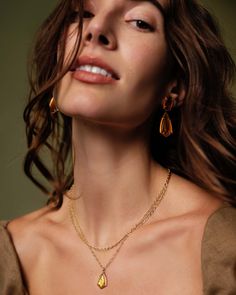 Thoughtfully designed for your styling needs, the Camry Gold Enamel Frame Multi Strand Necklace in Marbled Amber Illusion takes the guesswork out of necklace layering. A kite-shaped stone with a hand-painted enamel frame takes the spotlight in this duo, with a complementary chain adding just enough dimension. As timeless as it is fashion forward, this multi strand is bound to be part of your regular rotation. Metal 14k Yellow Gold Over Brass Material Marbled Amber Illusion Closure Lobster Clasp Elegant Layered Necklace For Jewelry Making, Layering Pendant Chain Necklace, Layered Gold-plated Necklace For Gifts, Layered Gold Plated Necklaces As Gift, Gold Teardrop Pendant Necklace For Layering, Layered Gold Plated Necklaces For Gifts, Layered Gold Plated Jewelry As Gift, Layered Gold Plated Necklace For Gift, Elegant Layered Gold-plated Jewelry