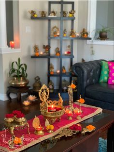 a living room filled with lots of furniture and decor on top of a wooden table