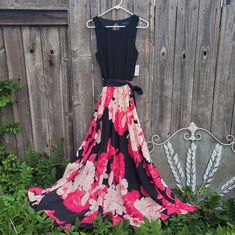 I.N.C. International Concepts Dress Nwt Size 10 Black Sleeveless Bodice With Peek-Hole Opening In The Back. Accompanied By A Beautiful Flowing Floral Skirt. The Lined Skirt Has Stylized Roses In Light And Vibrant Pink Against Black Background. The Black Fabric Sash Can Be Tied. The Top Is 95% Polyester And 5% Spandex The Bottom And Lining Are Both 100% Polyester. Chest 16.5" Waist 15" Can Be Tied Tighter With Sash Skirt Length 42" Black Full Skirt Dress For Summer, Pink Flowy Sleeveless Maxi Dress, Black Fit And Flare Maxi Dress For Spring, Spring Cocktail Maxi Dress With Full Skirt, Spring Black Maxi Dress With Full Skirt, Spring Black Full Skirt Maxi Dress, Spring Black Flowy Maxi Dress, Pink Sleeveless Dress With Flowy Skirt, Pink Flowy Sleeveless Dress