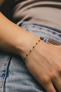 From our Color Romance Collection, this black enamel beaded piatto chain will add a pop of color to any outfit. Crafted in 14K gold, this 1 inch adjustable chain secures with a spring ring. NECKLACE DETAILS: Length: 7.5 Inches Millimeter: 1.7 Gauge: 030 Average Weight (g): 0.73 Closure: 5.0m Spring Ring Available in 14K Yellow Gold ***These necklaces have a 4 week lead time. If you need your necklace sooner than that, please contact us prior to ordering to verify if that's possible.*** | Black Enamel Bead Piatto Chain Bracelet In 14K Yellow Gold Ring - by Staghead Designs - Unisex Minimal Bangles Jewelry, Black Beads Mangalsutra Bracelet, Elegant Everyday Jewelry With Black Enamel, Elegant Black Chain Bracelet As Gift, Elegant Everyday Black Enamel Jewelry, 14k Gold Filled Beaded Chain Bracelets As Gift, Elegant Yellow Gold Bracelets With Black Beads, Black Gold-plated Bracelets, Elegant Yellow Gold Bracelet With Black Beads