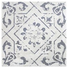 a white and blue rug with an ornate design