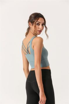 The EMES SHOP top is a perfect blend of bra and tank. for workout or personal plans. Features a soft and breathable material. a round neck front. and crossing back straps. Wear it with a high waist legging for a flawless finish. MATERIAL: 87% Nylon. 13% Spandex MEASUREMENTS: Small | Bust: 72" cm . Length: 33" cm Medium | Bust: 76" cm . Length: 34" cm Large | Bust: 80" cm . Length: 35" cm XL | Bust: 84" cm . Length: 36" cm MEASUREMENTS: Small | Bust: 28.3" in . Length: 13" in Medium | Bust: 29.9" Compressive Sleeveless Activewear With Straps, Crisscross Straps Sleeveless Sports Bra, Athleisure Sleeveless Sports Bra With Straps, Sports Tank Crop Top With Built-in Bra, Versatile Activewear With Built-in Bra And Cross Back, Cross Back Sports Bra With Straps For Yoga, Sleeveless Straps Activewear For Sports, High Stretch Tops With Built-in Bra And Cross Back, High Stretch Cross Back Tops For Gym