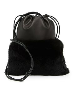 NEW Alexander Wang Ryan Mini Rabbit Fur Leather Shoulder Bag Color: Black Leather Size: 9.75" Hx 7.25" W x 0.5" D Condition: new with tags and box. Retail price: $695+tax A simple and sleek design that features genuine rabbit fur and a smooth leather construction. - Shoulder strap - Drawstring closure - Exterior features a leather construction, genuine rabbit fur, and topstitched detail - Approx. 9.75" x 7.25" W x 0.5" D - Approx. 17" handle drop - Imported Materials Leather exterior, genuine ra Mini Rabbit, Alexander Wang Bag, Style Kawaii, Studded Bag, Fur Bag, Rose Gold Studs, Clutch Black, Kandy, Leather Hobo Bag