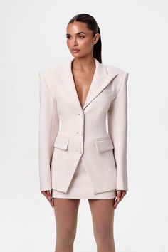 The iconic blazer suit, reimagined into an empowering form-fitting silhouette. Designed with long sleeves, notched collar and lapel, front pockets, front button down closures, and self-covered buttons at the cuffs. Style with our matching mini skirt to complete the look. Suiting Collection Import 94% Polyester, 6% Spandex Model wears size XS If between sizes, size down Blazer is lined Intern Aesthetic, Finesse Clothing, Off Shoulder Blazer, Realtor Aesthetic, Mini Suits, Buisness Casual, Cool Outfit Ideas, Structured Shoulder, Naked Wardrobe