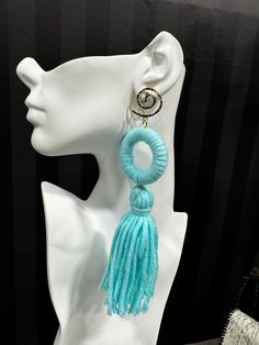 Made from dense, soft yarn, these statement earrings feature a bold ring and flowing tassel design. Available in multiple colors, they are perfect for adding a playful, yet sophisticated flair to any outfit. Chic Handmade Tassel Drop Earrings, Trendy Tassel Earrings, Chic Tassel Earrings, Chic Dangle Tassel Earrings, Trendy Tassel Fringe Drop Earrings, Trendy Tassel Drop Earrings With Fringe, Diy Statement Earrings, Yarn Earrings, Yarn Tassel