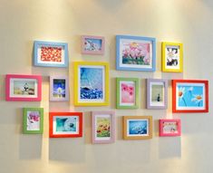 a wall with many different colored frames on it