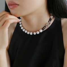 Elevate your outfit with this black spinel and round baroque pearl OT choker that exudes sophistication. This choker is expertly crafted, with stunning black spinel beads and dazzling round baroque pearls creating a harmonious contrast of textures and tones. The adjustable OT clasp ensures a comfortable fit, and the elegant design easily transitions from day to evening, making it a versatile addition to your jewelry collection. Metal: Recycled Sterling Silver Plated On Brass Pearl: Freshwater Baroque Pearls 10-11mm Gemstone: Black Spinel Chain Length: 390mm Weight: 54g Luxury Black Pearl Chain Necklace, Luxury Black Pearl Necklace With Round Beads, Black Pearl Necklace With Round Bead Pendant, Black Pearl Necklace With Pearl Pendant, Black Baroque Pearl Necklace With Pearl Chain, Black Baroque Pearl Necklace With Pearl Drop, Black Baroque Pearl Drop Necklace, Elegant Black Pearl Drop Necklace, Elegant Formal Jewelry With Black Beads