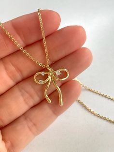 Add a touch of feminine charm to your ensemble with our delightful Tiny Bow Charm from Dylan Rae Jewelry! Perfect for elevating your look with a whimsical and feminine detail, this delicate charm is a must-have accessory. Explore our collection and discover the perfect piece to express your unique style today! ✨ #DylanRaeJewelry