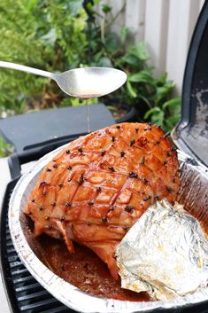 a piece of meat is being served on a grill