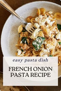 a bowl filled with pasta and cheese on top of a table