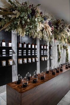 the shelves are filled with various types of coffees and teas on display in front of them