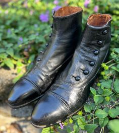 One of many antique shoes we have for sale! A pair of Antique (c1900-1910s) Mens button up boots/shoes. Can be unisex. Jet Black color in a smooth leather fabric. *Refer to last photo and condition comments-see below for notable Issues.  PLEASE REVIEW MEASUREMENTS provided below, and compare to yours, (especially the width of your foot, as well as the length). These antique shoes/boots tend to run very narrow and small. Don't hesitate to ask if I can be of any help. Size: looks like size 10 indicated-but it is always best to refer to measurements when purchasing Antique shoes.  These boots tend to be more narrow than modern, please check your own width and arch carefully.  Measurements: -inner footbed measurement 10.5-10.75" -outer sole length-toe tip to back of the heel is 11.25" Heel hei