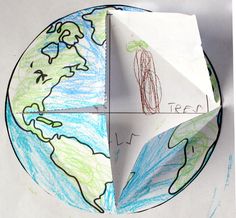 an origami paper model with the earth on it