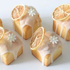 some orange slices are cut in half and placed on top of each other with icing