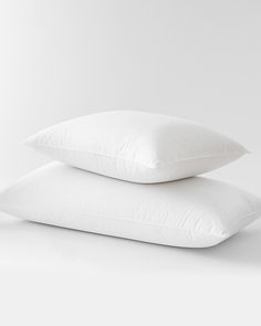 two pillows stacked on top of each other