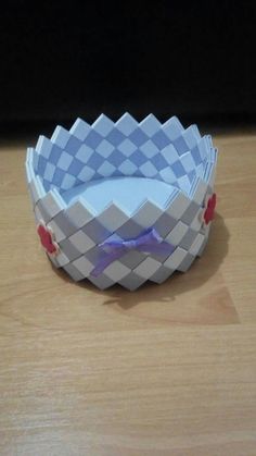 a paper bowl sitting on top of a wooden table