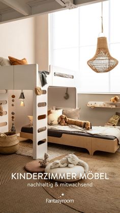 a bed room with bunk beds and pillows on the floor next to a large window