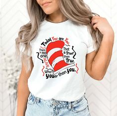 "Cat In The Hat Shirt, Today You Are You Shirt, Teacher Shirt, Cat Hat Tee, Elementary Teacher Tee, Seuss  Teacher Gift, Teacher Gift Hello! Thank you for supporting as two partner women owned small business. Our main priority here is the satisfaction of our customers High quality and super soft, comfortable shirt. Made with new teleology DTF and New systems film pressed with a professional grade heat press. Please check all color and size charts before place the order. Since all shirts are custom made based on your selection, I don't accept return or exchange unless there is an issue with your order. I'm working with different brands based on the availability. OUR T-shirts are Bella+Canvas brand also Hoodies and Sweatshirts are Gildan. If Bella+Canvas is out of stock, I will send it from Cat In The Hat Shirt, Cat In The Hat, Teacher Tees, Cat Hat, Teacher Outfits, Gift Teacher, Elementary Teacher, White Shirts, Work Shirts