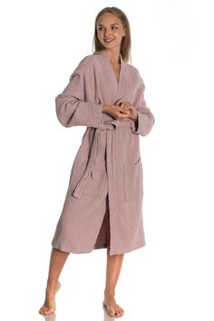 "Introducing the Short Muslin Kimono Bathrobe - the ultimate combination of comfort and style. This unisex robe is made from premium quality muslin fabric that is incredibly soft and lightweight, making it perfect for lounging around the house or slipping into after a refreshing shower. The kimono-style design features a relaxed fit with a wide collar and loose sleeves that provide ample room for easy movement. The robe is generously cut to fit most body types and the adjustable belt ensures a comfortable and customized fit. Crafted with care and attention to detail, this bathrobe is designed to last for years. The muslin fabric is not only durable but also easy to care for - simply toss it in the washing machine and tumble dry low. Whether you're looking for a cozy robe for yourself or a Kimono Bathrobe, Baby Poncho, Mode Kimono, Cotton Gauze Fabric, House Coat, Kimono Design, Satin Kimono, Loose Sleeves, Muslin Fabric