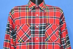 Chest 24 in.  Length 29 in.   Sleeve 22 in.  Shoulder 18 in.  Tag Says: Big Mac JC Penney, L Tall, 65% Cotton, 35% Polyester  This awesome button down flannel was made by Big Mac in the 70s. It has the sort of big collar that was popular at the time, and the shirt is decorated with a colorful plaid design.   Comments: This shirt fits like a modern men's large tall           BD70s-127612 Collared Red Flannel Shirt For Work, Red Collared Flannel Shirt For Work, Casual Red Flannel Shirt With Buttons, Red Shirt With Snap Buttons For Fall, Red Fall Shirt With Snap Buttons, Fall Red Shirt With Snap Buttons, Flannel Top With Snap Buttons And Collared Shape, Red Casual Shirt With Placket, Casual Red Shirt With Placket